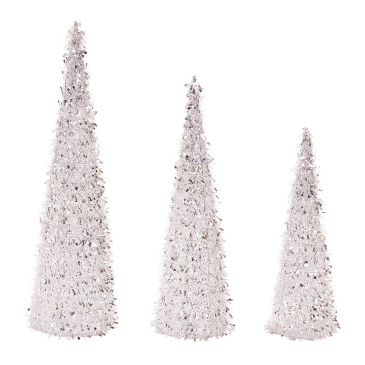 Three white decorative trees of different heights on a white background