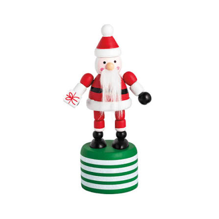 A small Santa Claus figurine standing on a round green and white striped base, holding a wrapped gift in one hand and a black ball in the other, photographed on a plain white background.