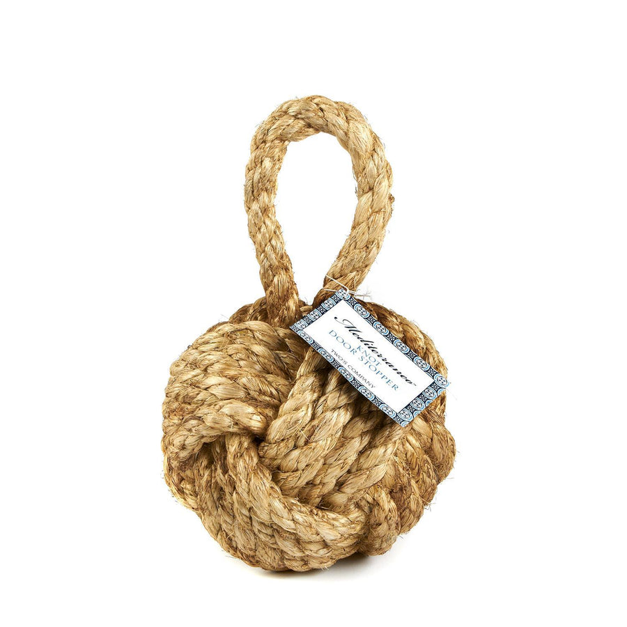 A beige door stop rope knot with a label that reads 'Two's Company'.